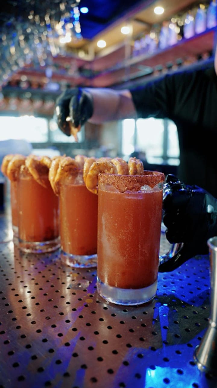 Micheladas being made at the bar