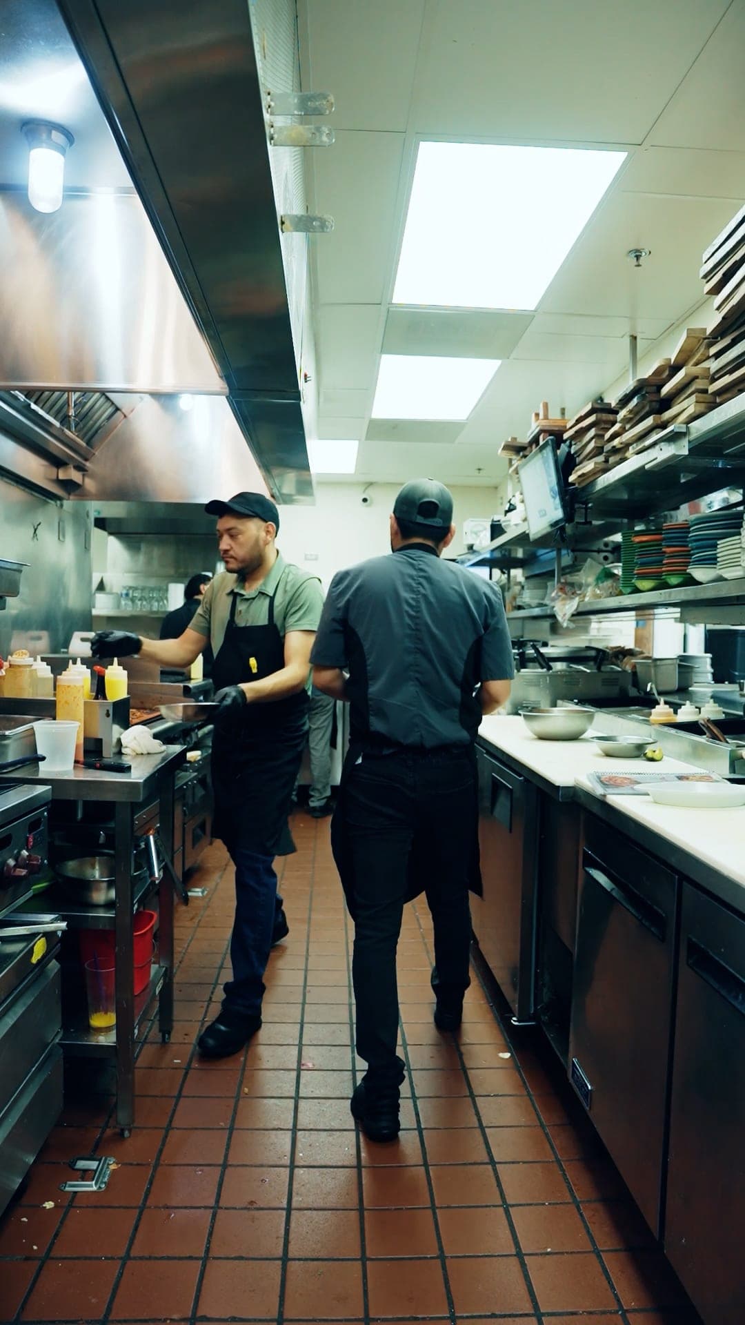 Mariscos Costa Alegre cooks preparing dishes in the kitchen