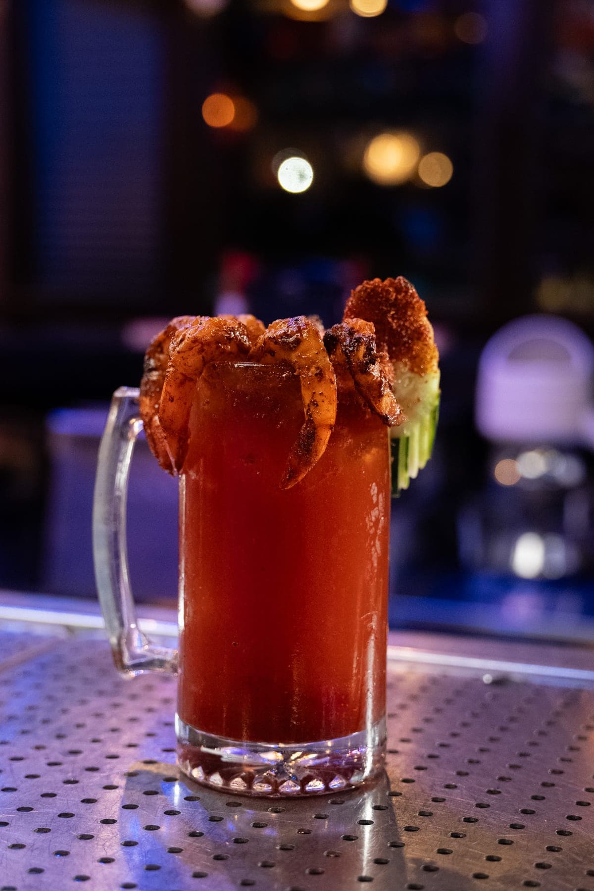 Michelada Super topped with grilled shrimp and bacon on the rim